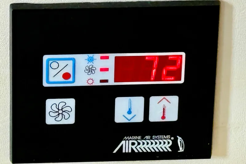 Slide: The Image of Marine air systems control panel displaying temperature at 72 degrees on a 2000 Silverton 351 Sedan. - 39