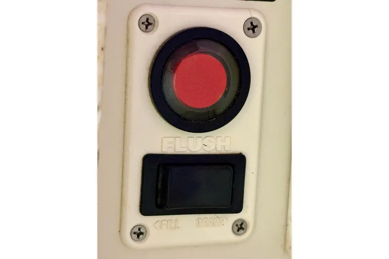 Slide: The Image of Flush button panel on a 2000 Silverton 351 Sedan boat. - 48
