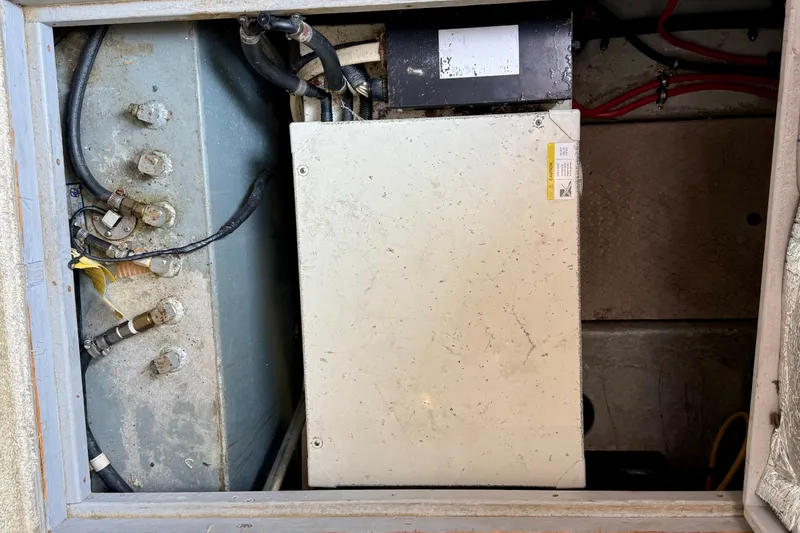 Slide: The Image of Engine compartment of a 2000 Silverton 351 Sedan with visible wiring and components. - 52