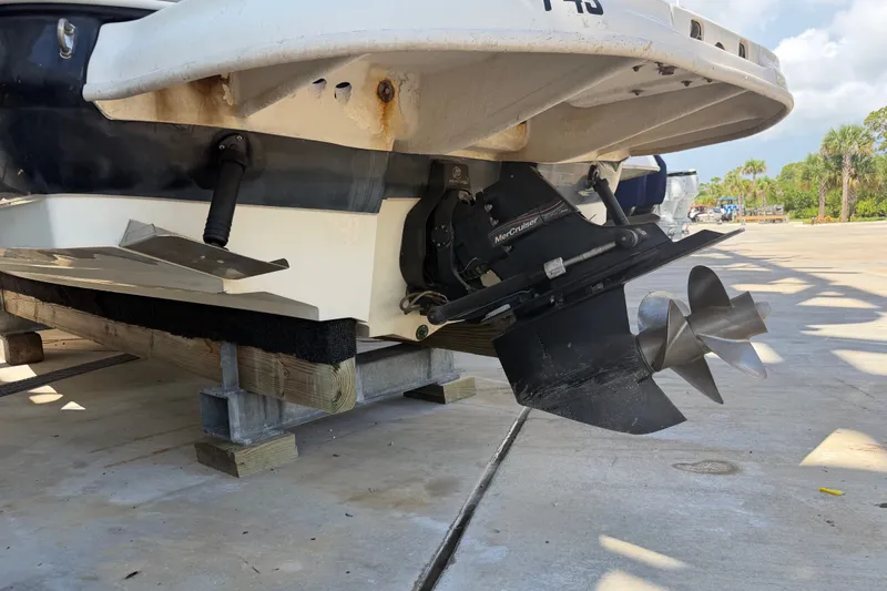 Slide: The Image of Rear view of a 2006 Sea Ray 240 Sundeck boat on a dock. - 6