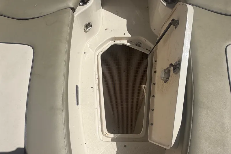 Slide: The Image of Open storage compartment on a 2006 Sea Ray 240 Sundeck boat. - 47