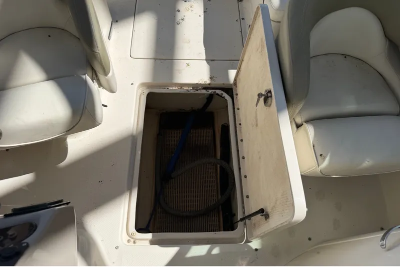 Slide: The Image of Open storage compartment on 2006 Sea Ray 240 Sundeck boat deck. - 16