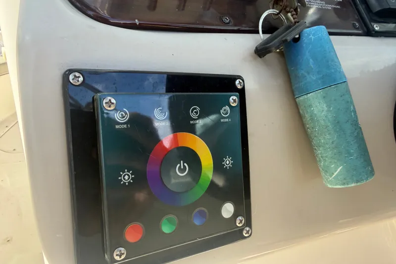 Slide: The Image of Control panel on a 2006 Sea Ray 240 Sundeck boat dashboard. - 25
