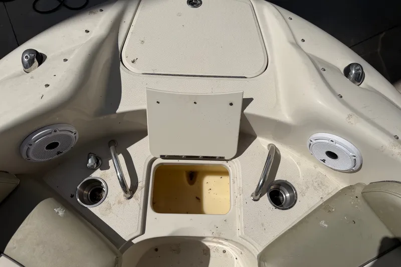 Slide: The Image of 2006 Sea Ray 240 Sundeck boat interior with speakers and storage compartments. - 53