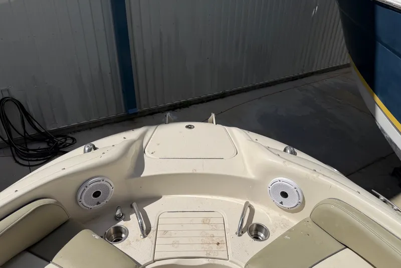 Slide: The Image of 2006 Sea Ray 240 Sundeck boat interior with speakers and cup holders. - 52