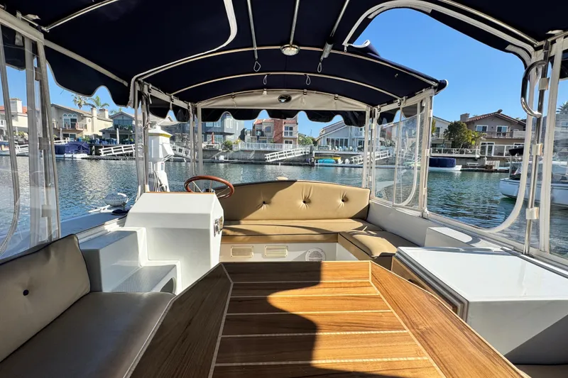 Slide: The Image of Interior of a 2008 Duffy Snug Harbor boat with seating and waterfront view. - 7