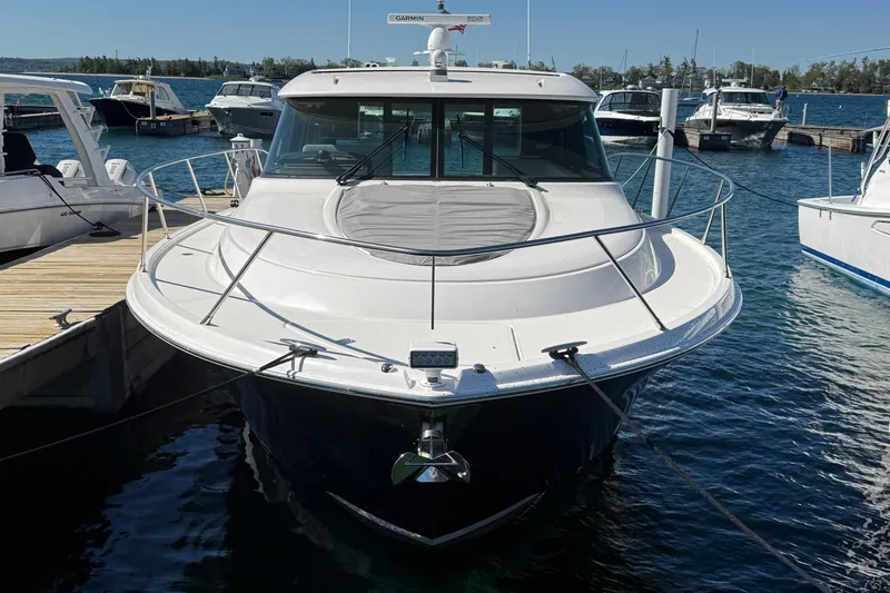 Slide: The Image of 2019 Tiara Yachts C44 Coupe docked at marina, front view. - 1
