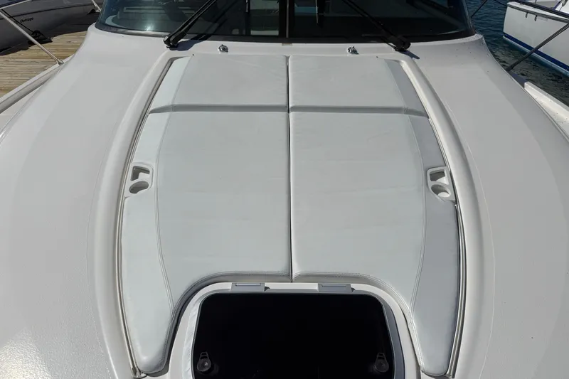 Slide: The Image of 2019 Tiara Yachts C44 Coupe deck with sunpad and hatch. - 19