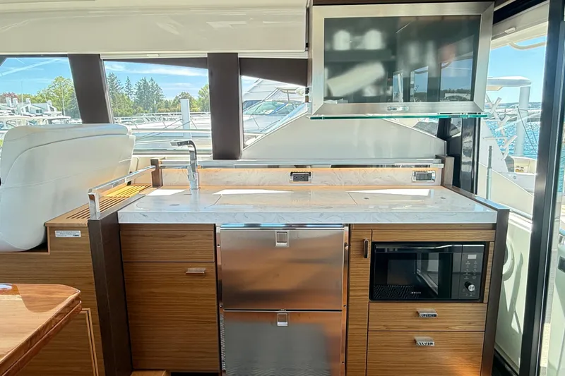 Slide: The Image of Luxurious interior of 2019 Tiara Yachts C44 Coupe featuring modern kitchen amenities. - 21