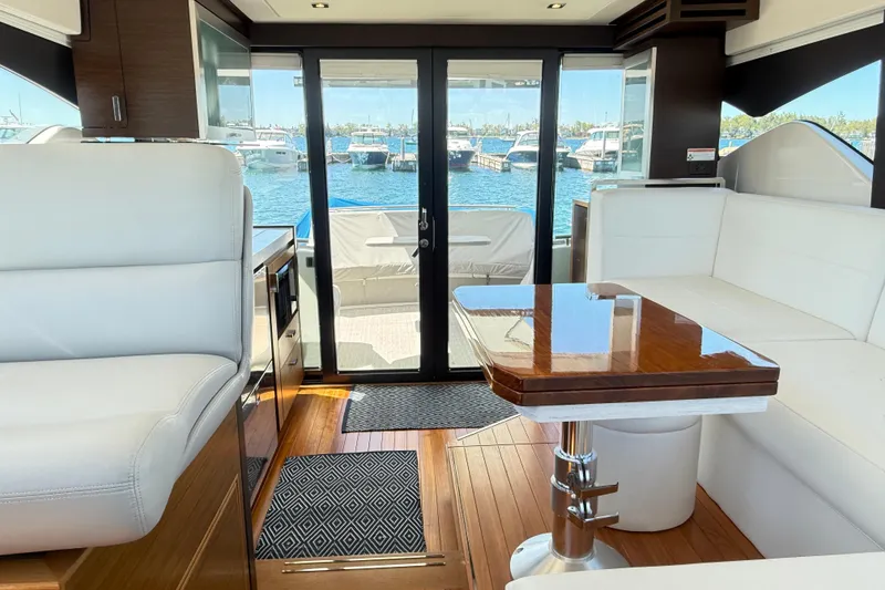 Slide: The Image of Luxurious interior of 2019 Tiara Yachts C44 Coupe with elegant seating and wooden table. - 26