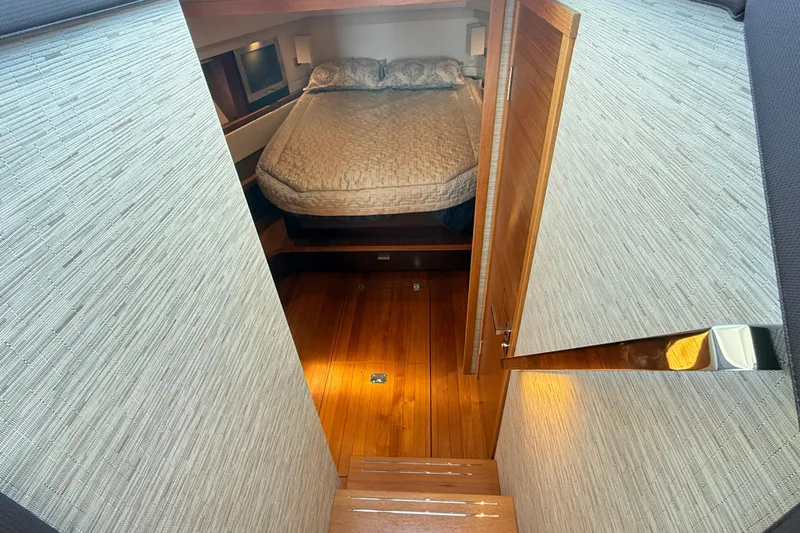Slide: The Image of Luxurious cabin interior of 2019 Tiara Yachts C44 Coupe with wooden flooring. - 28