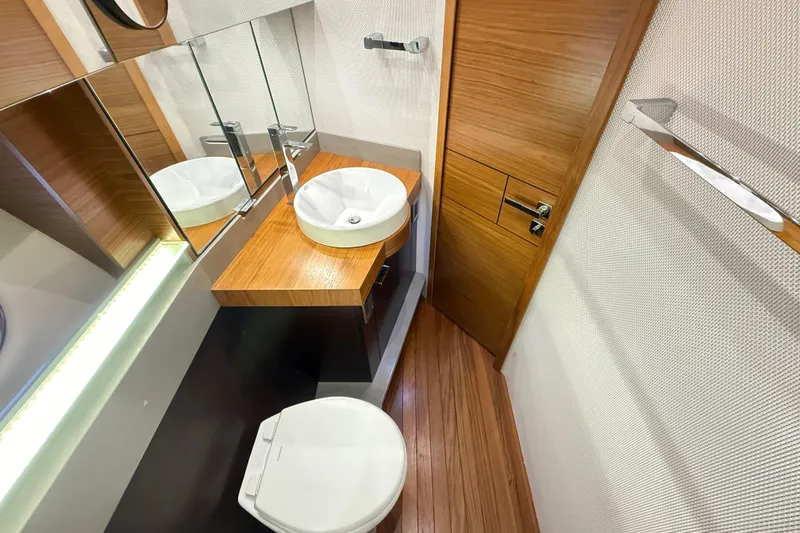 Slide: The Image of Luxurious bathroom interior of 2019 Tiara Yachts C44 Coupe with modern fixtures. - 34