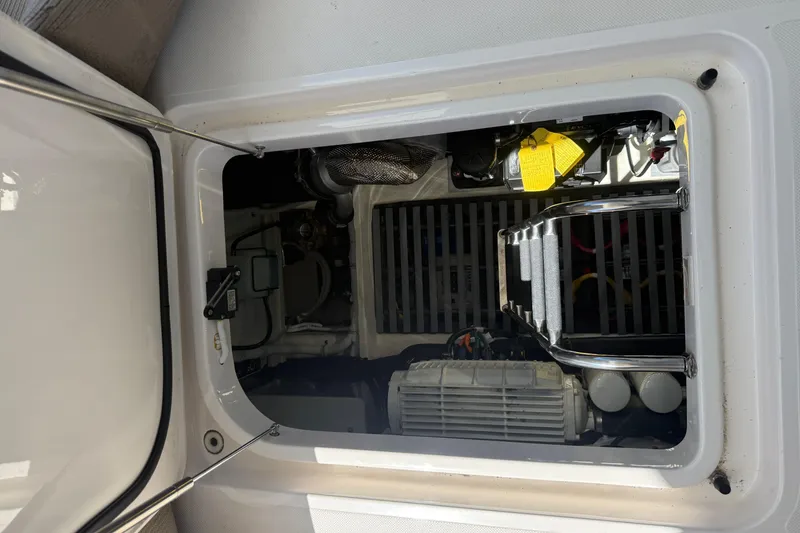 Slide: The Image of Engine compartment of a 2019 Tiara Yachts C44 Coupe, showcasing mechanical components. - 40