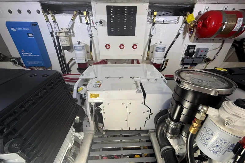 Slide: The Image of Engine room of 2019 Tiara Yachts C44 Coupe with various mechanical components. - 41