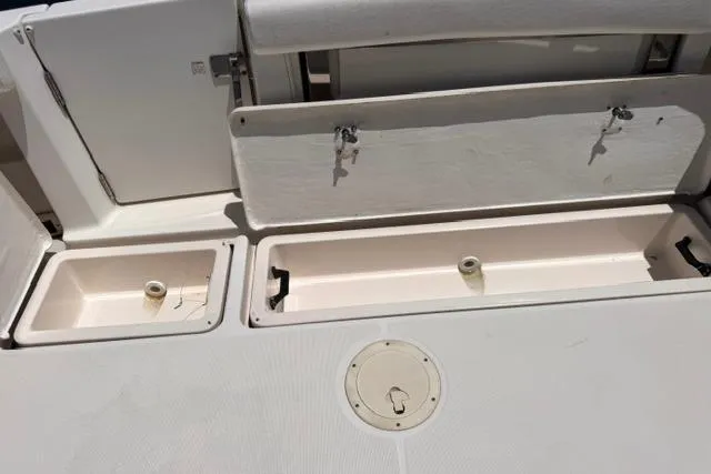 Slide: The Image of 2001 Tiara Yachts 2900 Open deck storage compartments and seating area. - 11