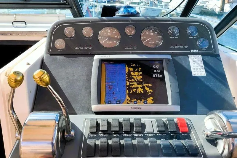 Slide: The Image of 2001 Tiara Yachts 2900 Open dashboard with Garmin navigation system and control panel. - 2