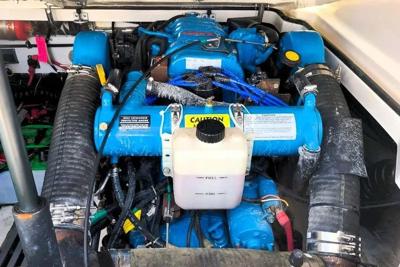 Slide: The Image of Engine compartment of a 2001 Tiara Yachts 2900 Open, showcasing blue marine engine components. - 22