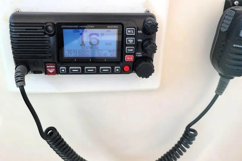 Slide: The Image of VHF marine radio on 2001 Tiara Yachts 2900 Open, displaying channel 16 distress signal. - 6