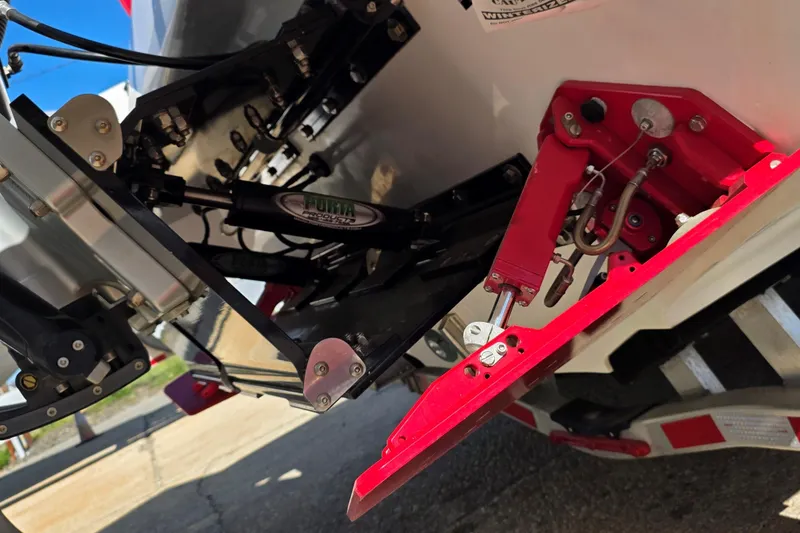Slide: The Image of Close-up of 2024 Velocity 290 Sport Cruiser's trim tabs and hydraulic system. - 11