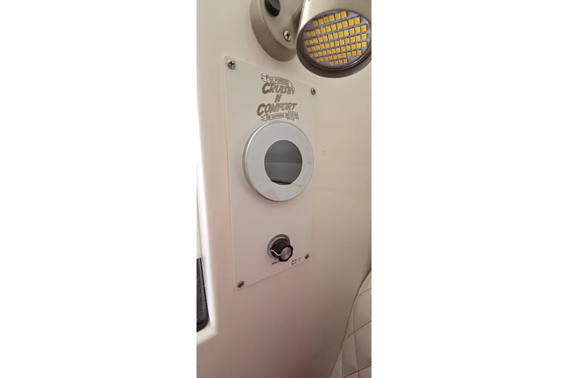Slide: The Image of Control panel on 2024 Velocity 290 Sport Cruiser boat, featuring lighting and comfort controls. - 13