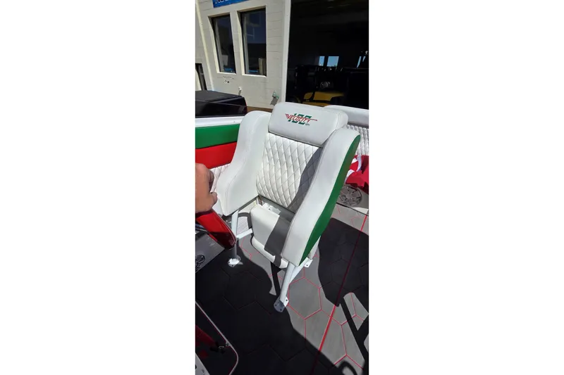 Slide: The Image of 2024 Velocity 290 Sport Cruiser seat with white upholstery and logo detailing. - 18