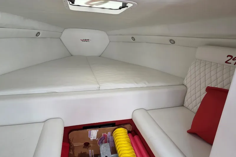 Slide: The Image of Interior cabin of 2024 Velocity 290 Sport Cruiser with white upholstery and storage space. - 5