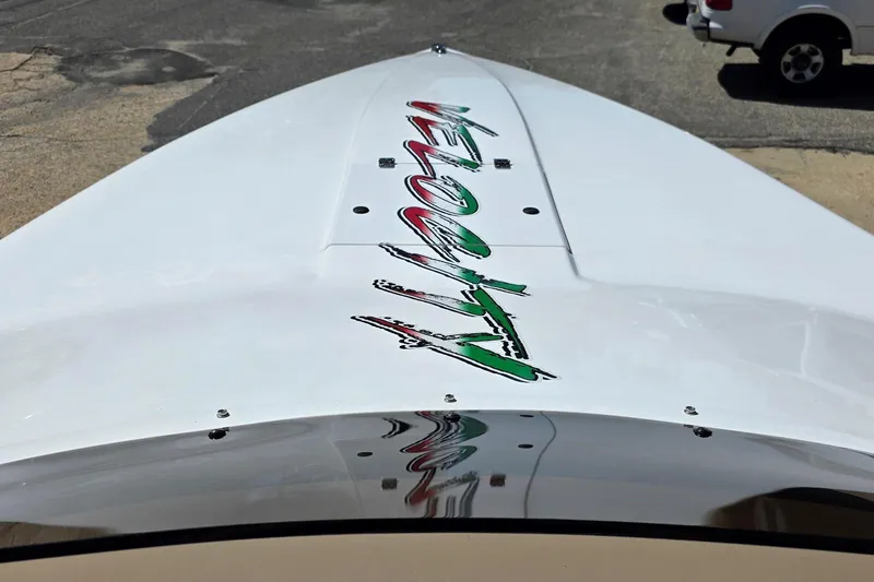 Slide: The Image of 2024 Velocity 290 Sport Cruiser boat with sleek design and vibrant logo on deck. - 7
