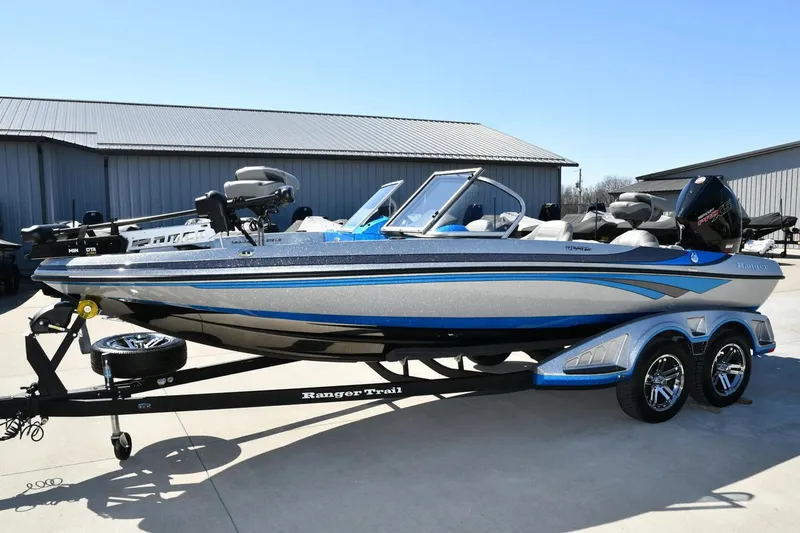 The Image of 2024 Ranger 212LS Reata boat on trailer, parked outdoors. - 1