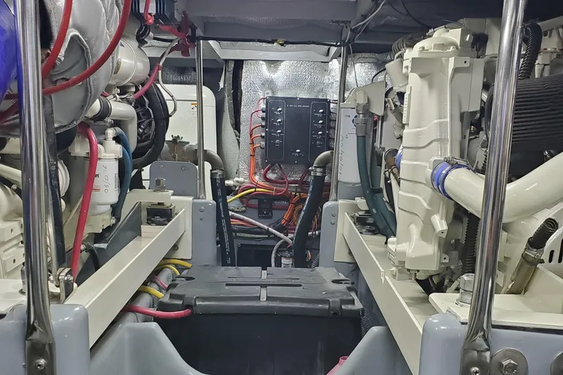 Slide: The Image of Engine room of a 2000 Silverton 42 Convertible boat, showcasing mechanical components. - 29
