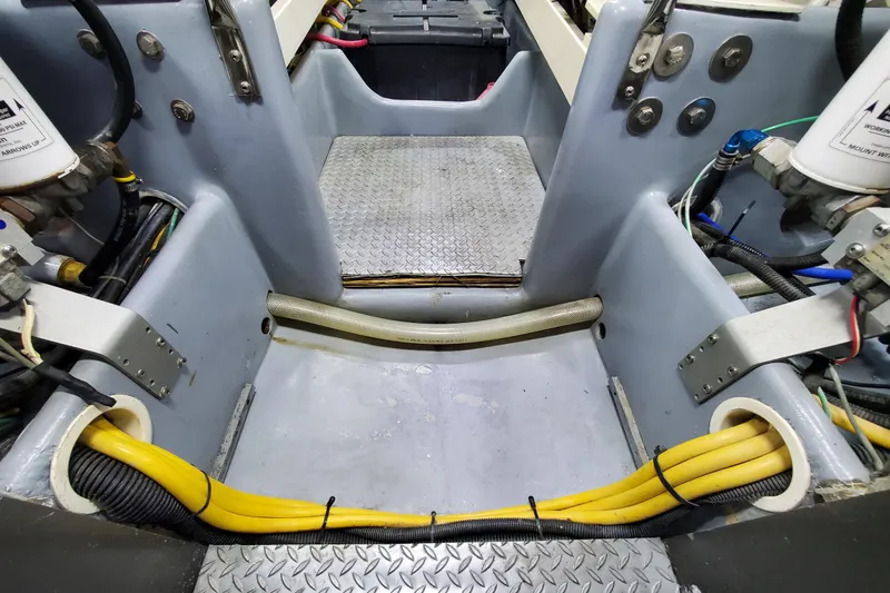 Slide: The Image of Engine room of a 2000 Silverton 42 Convertible boat, showcasing wiring and components. - 30