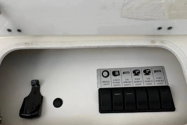 Slide: The Image of Control panel of a 2000 Silverton 42 Convertible boat with labeled switches. - 40