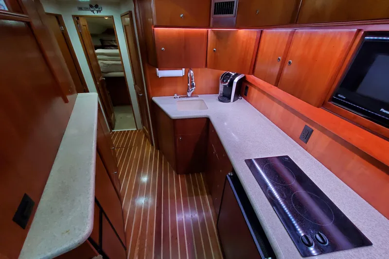 Slide: The Image of Luxurious galley in 2000 Silverton 42 Convertible yacht with modern amenities. - 41