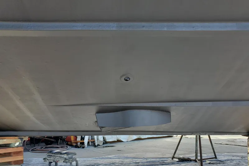 Slide: The Image of Underside view of a 2000 Silverton 42 Convertible boat on stands. - 8