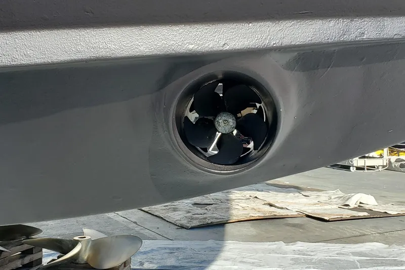Slide: The Image of Close-up of a 2000 Silverton 42 Convertible boat's propeller and thruster. - 9