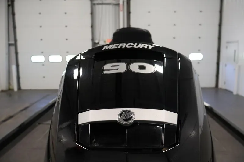 Slide: The Image of 2024 Crestliner XFC 179 with Mercury 90 engine in a garage setting. - 15