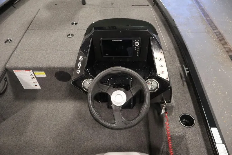 Slide: The Image of 2024 Crestliner XFC 179 boat dashboard with steering wheel and control panel. - 28