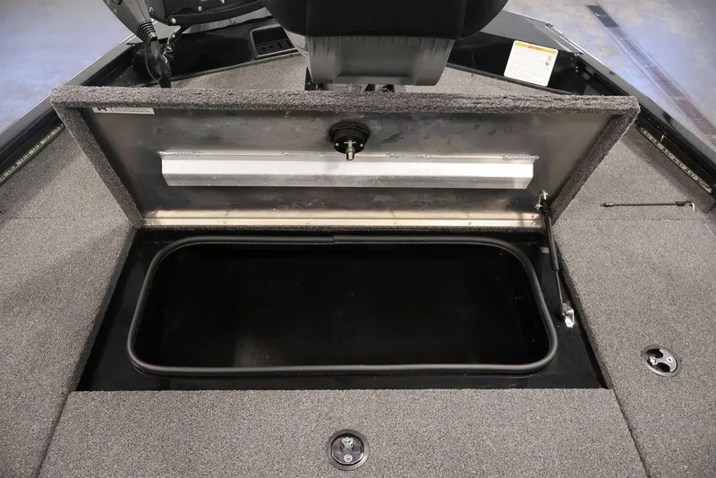 Slide: The Image of 2024 Crestliner XFC 179 boat storage compartment with open lid, showcasing interior space. - 29