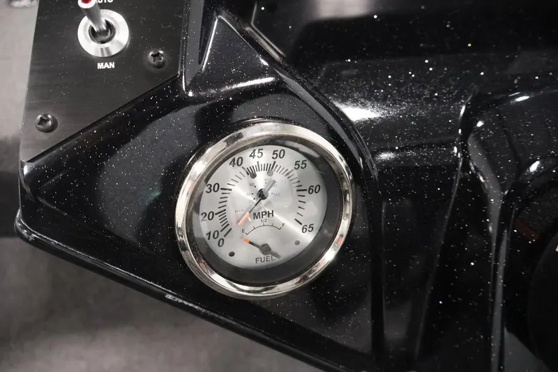 Slide: The Image of 2024 Crestliner XFC 179 dashboard with speedometer and manual switch. - 32