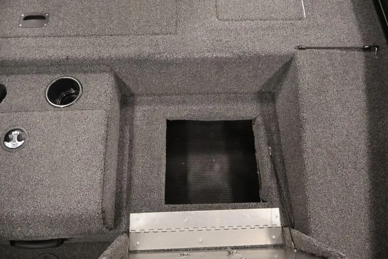 Slide: The Image of Interior view of 2024 Crestliner XFC 179 boat, featuring carpeted flooring and storage compartments. - 36