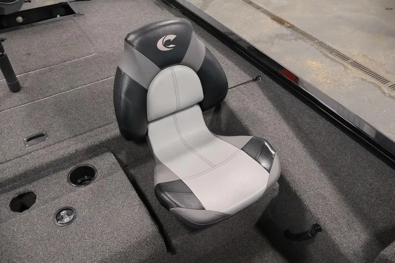Slide: The Image of 2024 Crestliner XFC 179 boat seat with gray and black upholstery, featuring a cup holder. - 37