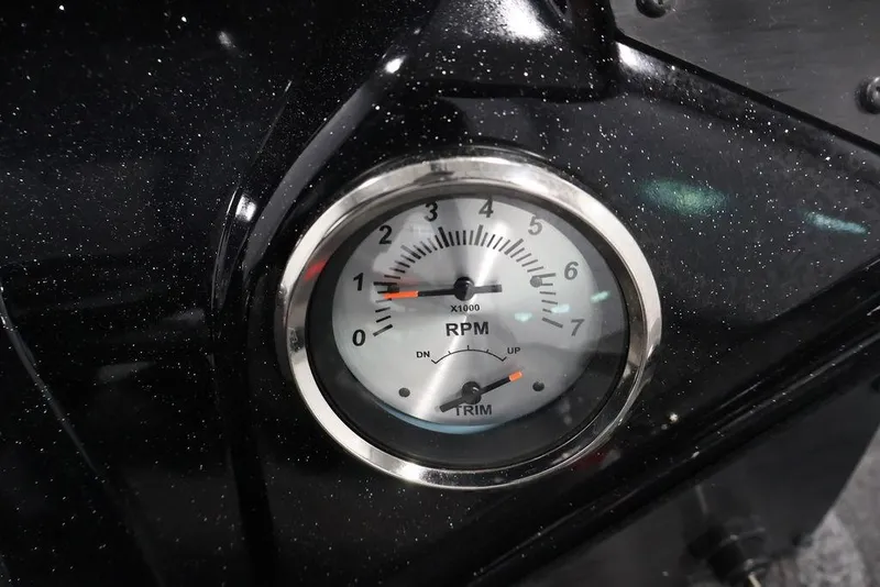 Slide: The Image of Close-up of RPM gauge on 2024 Crestliner XFC 179 boat dashboard. - 38