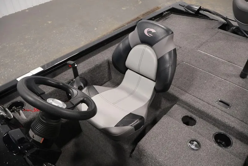 Slide: The Image of 2024 Crestliner XFC 179 boat interior with steering wheel and cushioned seat. - 39