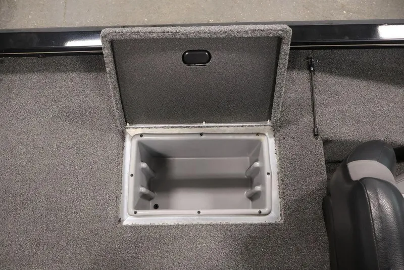 Slide: The Image of 2024 Crestliner XFC 179 boat storage compartment with open lid, showcasing interior space. - 43