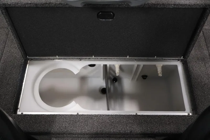 Slide: The Image of 2024 Crestliner XFC 179 livewell compartment with dual sections and plumbing. - 44
