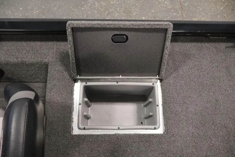 Slide: The Image of 2024 Crestliner XFC 179 boat storage compartment with open lid, showcasing interior space. - 45