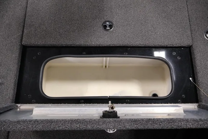Slide: The Image of 2024 Crestliner XFC 179 boat storage compartment with open hatch, showcasing interior space. - 46
