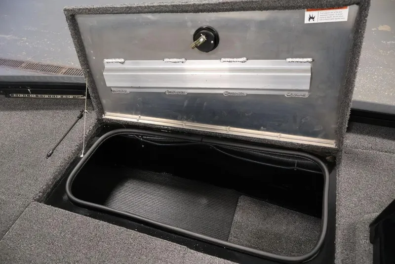 Slide: The Image of Open storage compartment in 2024 Crestliner XFC 179 boat, showcasing interior space. - 50