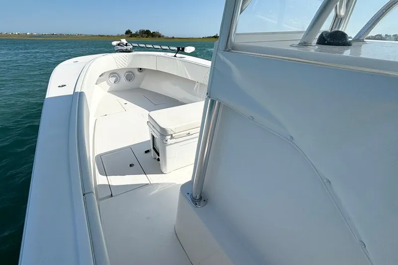 Slide: The Image of 2025 Competition 31 boat on water, featuring spacious deck and sleek design. - 12