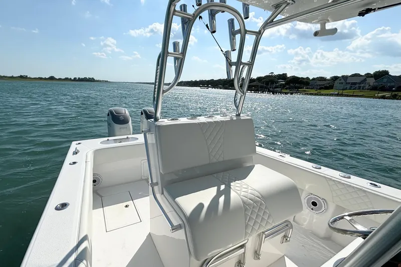 Slide: The Image of 2025 Competition 31 boat interior on a sunny day, showcasing sleek design and open water. - 14