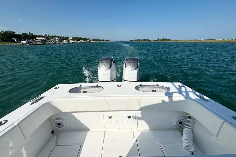 Slide: The Image of 2025 Competition 31 boat cruising on a scenic waterway with twin engines. - 15